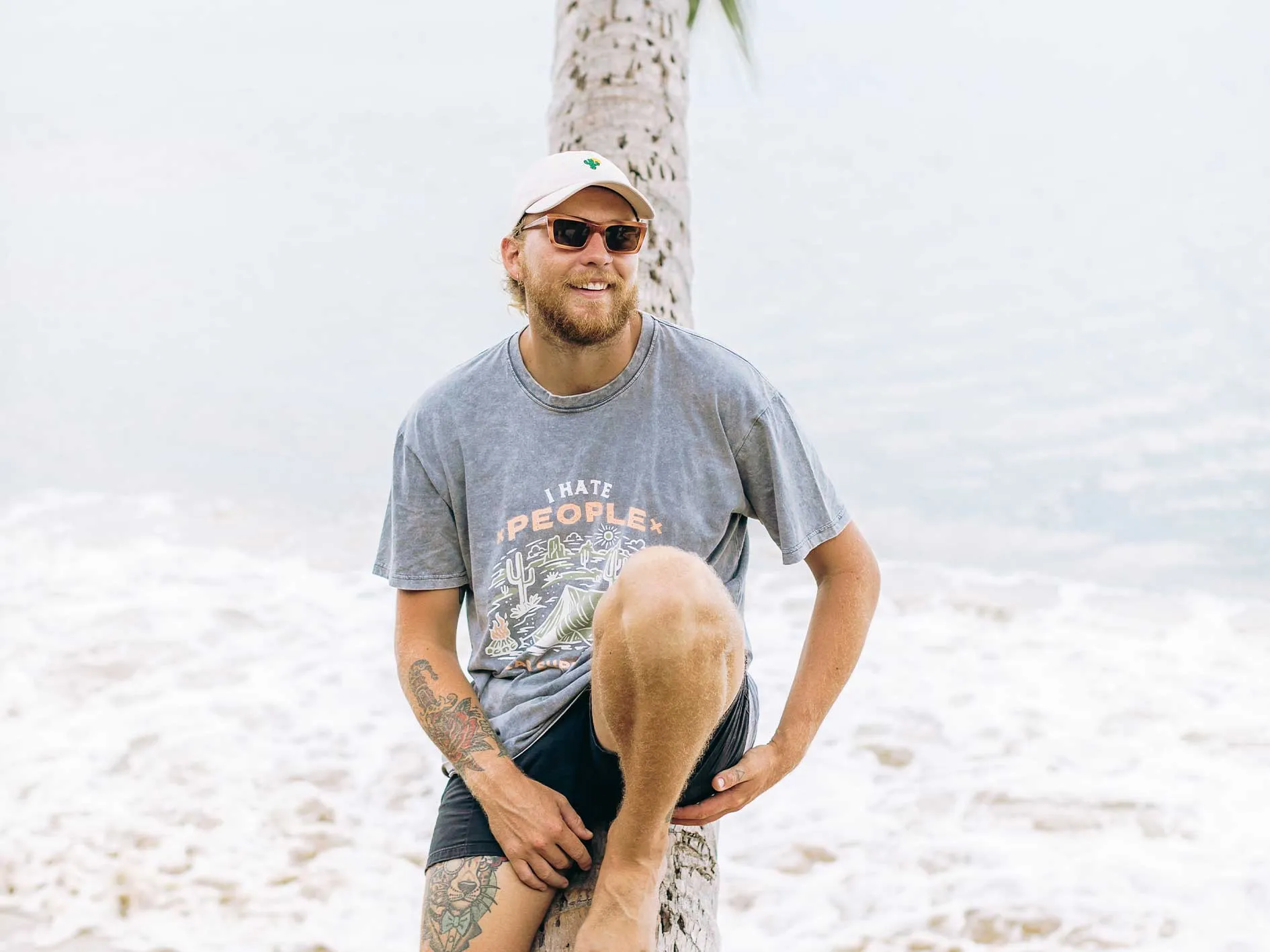 surfer wearing white hat and blue top