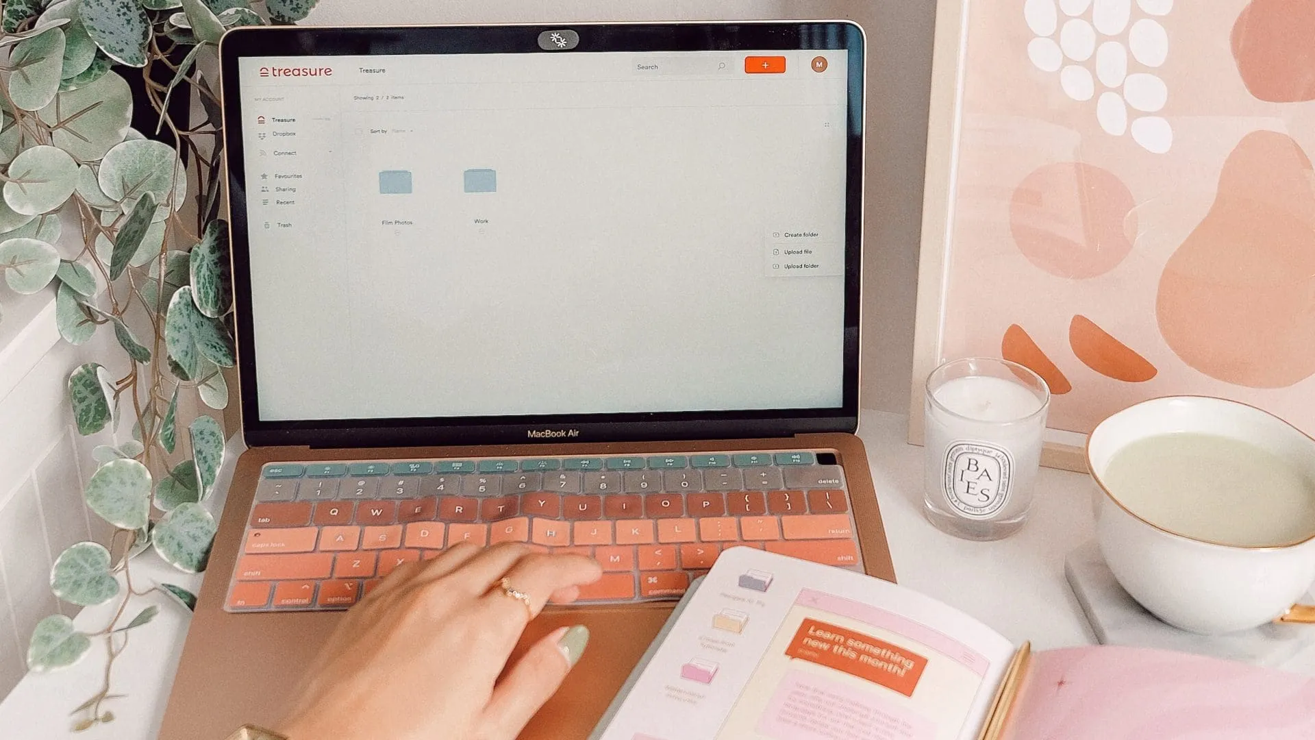laptop and diary on desk