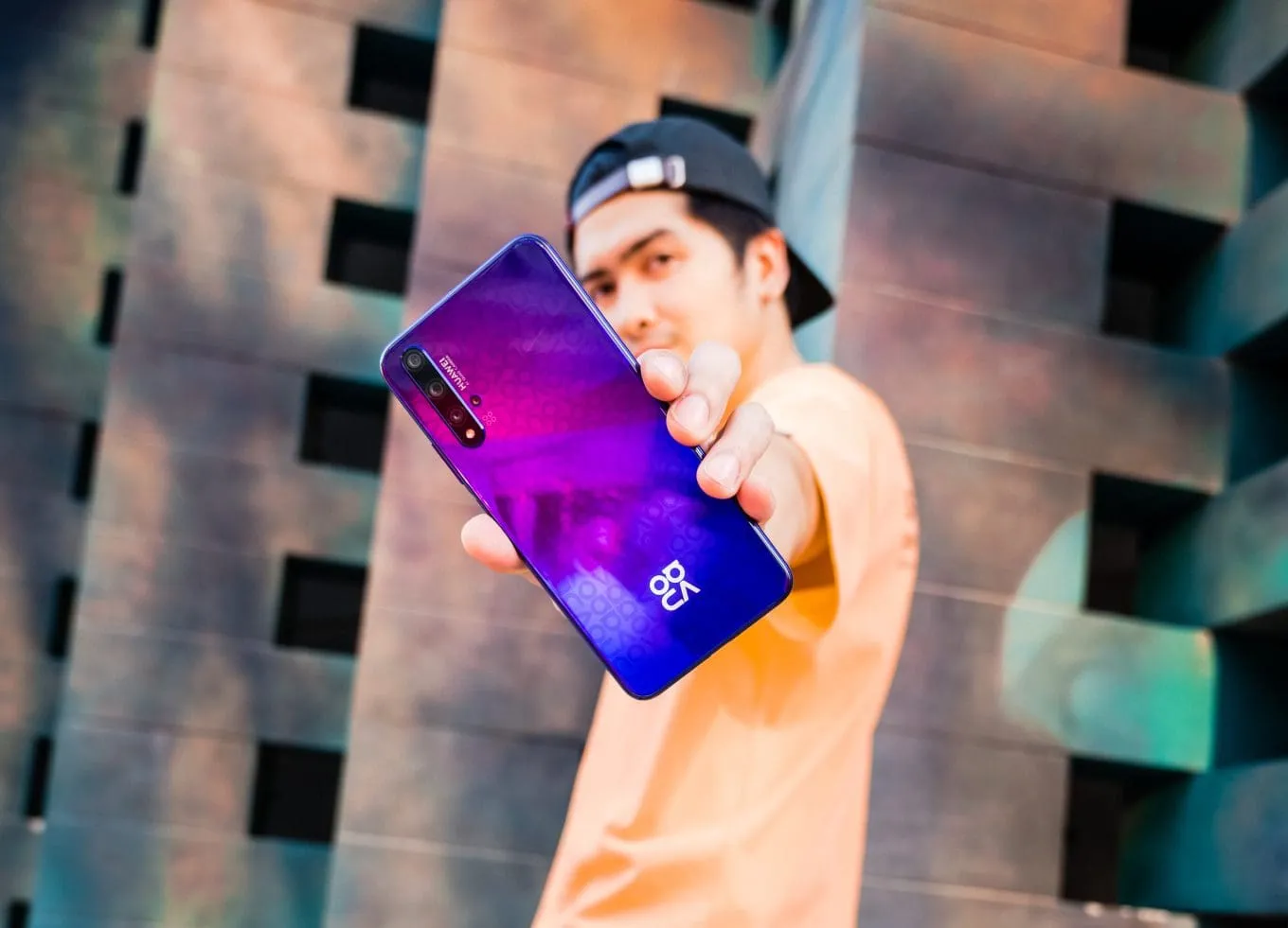 Person holding a mobile phone up to the camera