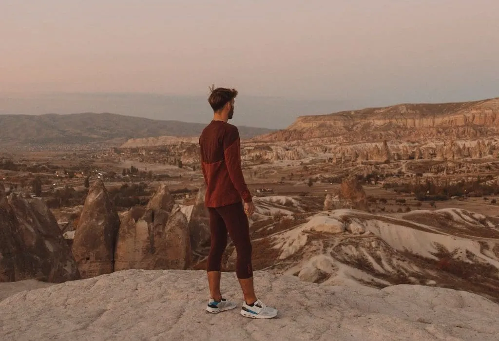 man looking out to canyon