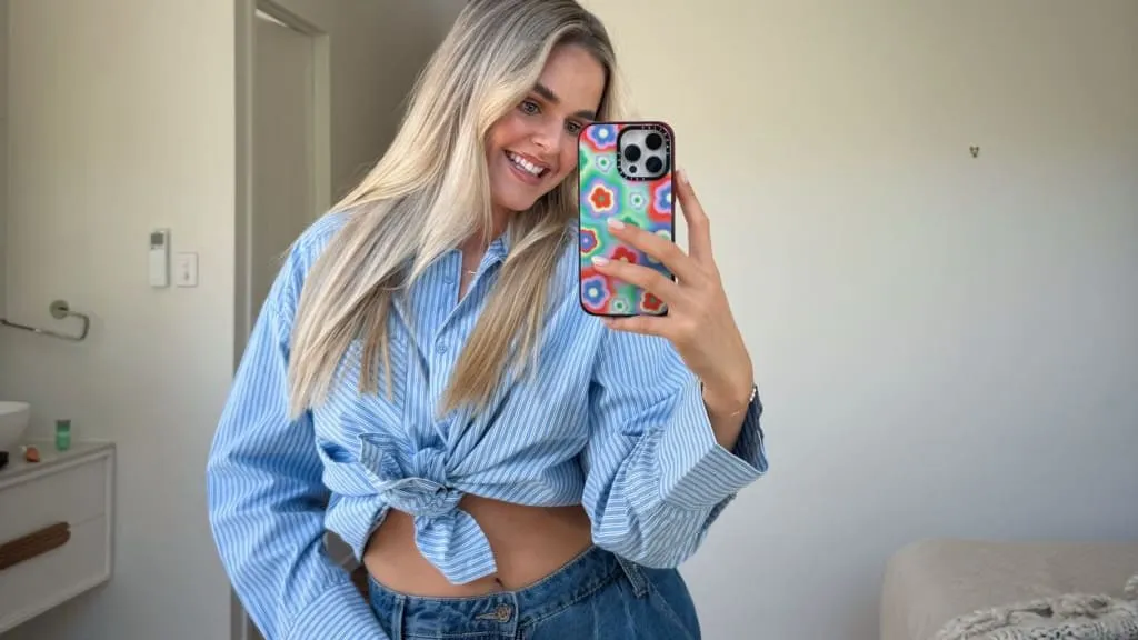 woman in striped top taking selfie