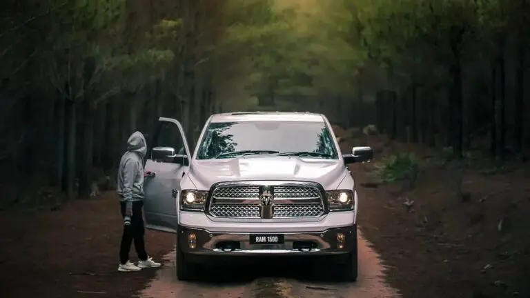 man and jeep in woods