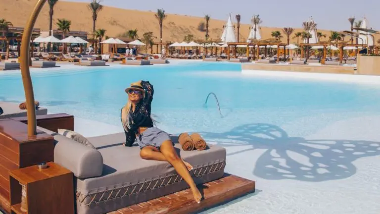 woman at beach club on sun lounger