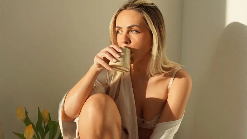 woman drinking coffee in nightwear
