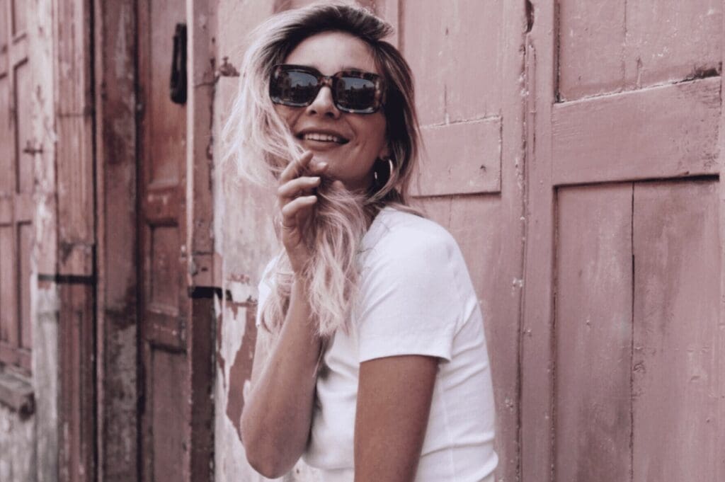 woman in sunglasses and white tshirt
