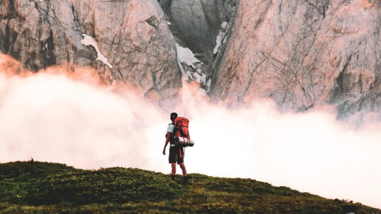 man hiker in front of mountain