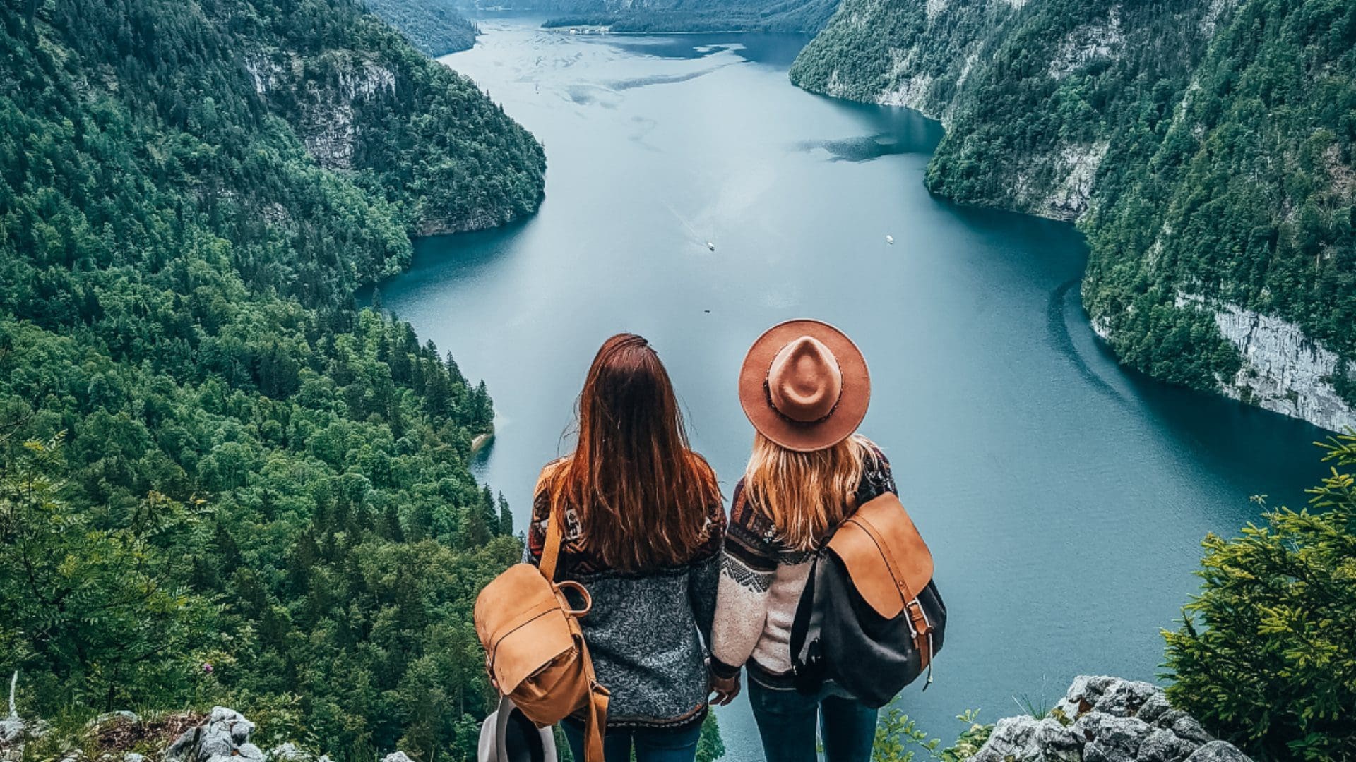 two women looking over lake landscape