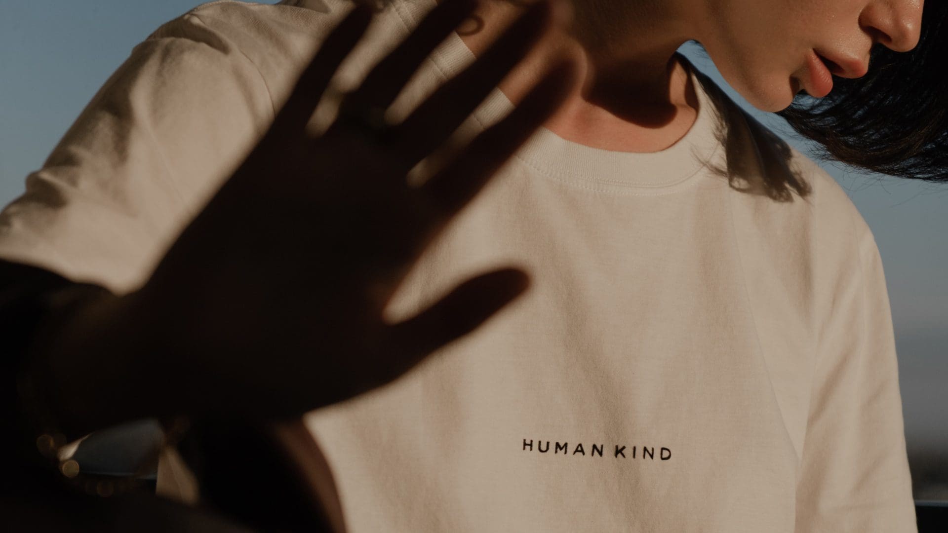 woman wearing white t shirt with human kind printed on itlolitamas @theofficialselfridges