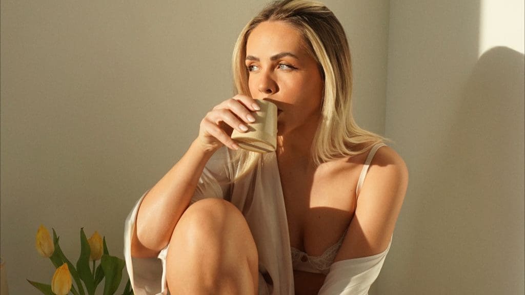 woman drinking coffee in nightwear