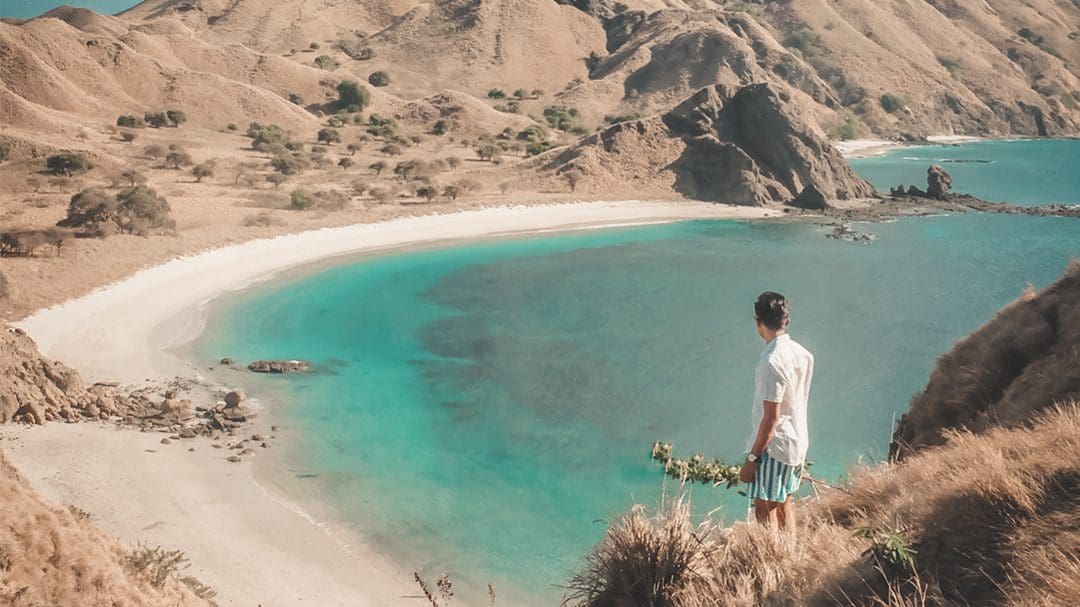 man looking out to beach