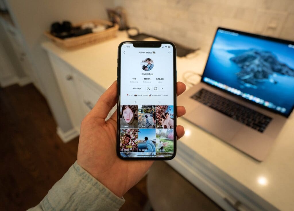 social app on mobile phone screen in palm of hand