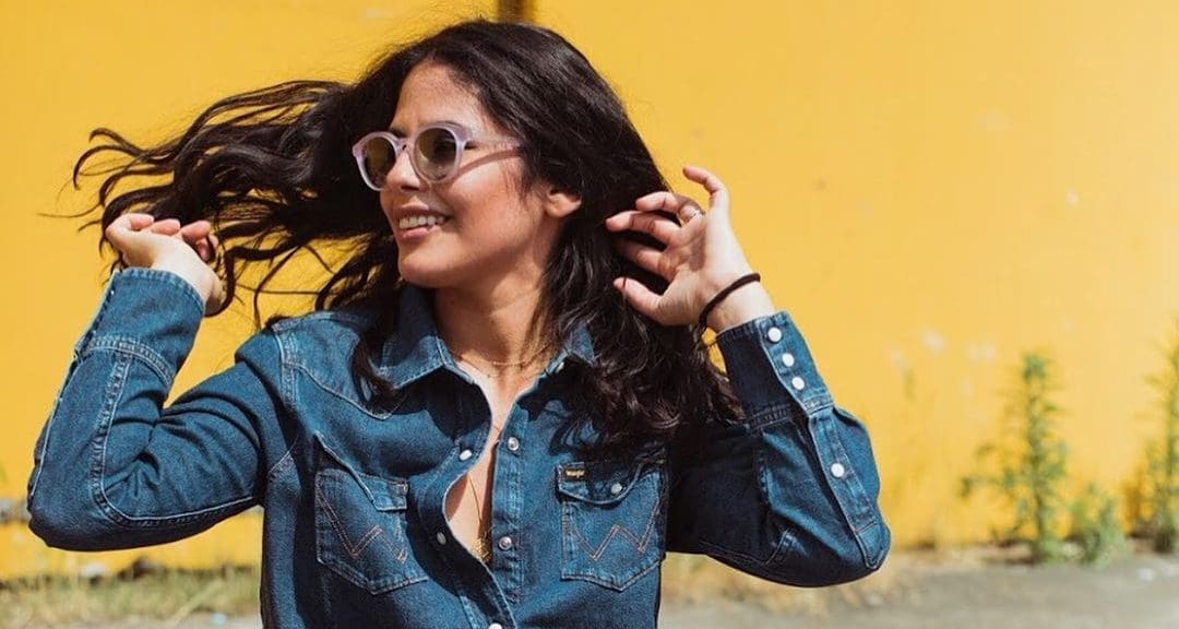 woman wearing glasses and denim shirt