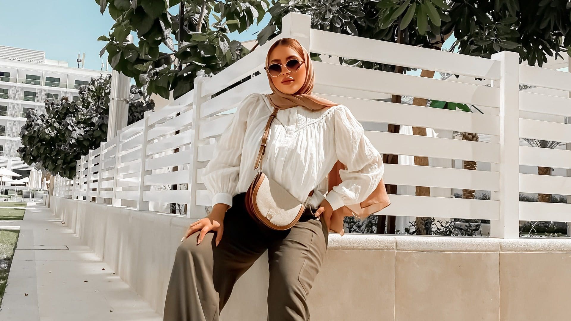 woman wearing head scarf and white shirt