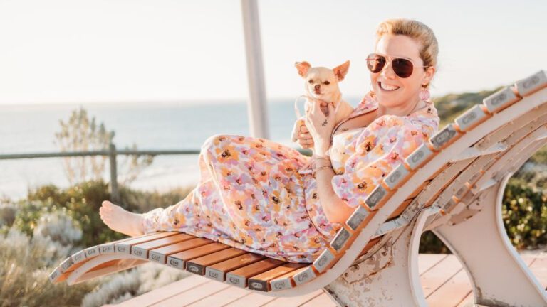 woman on sun lounger with chihuahua